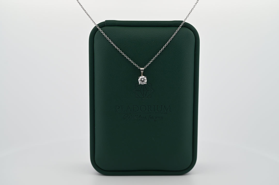 Ethernal Sparkle 0.3 CT pendant on platinum chain, elegant packaging, symbol of timeless luxury and craftsmanship for women.