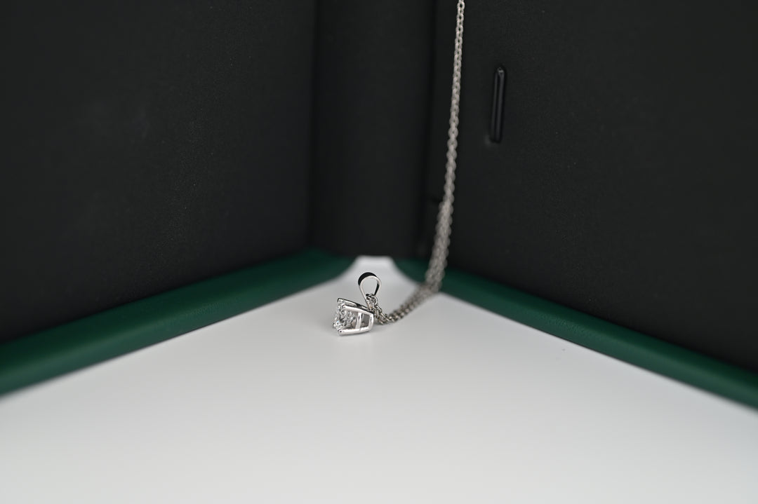 Ethernal Sparkle platinum pendant with 0.5 CT lab-grown diamond, elegantly displayed in a jewelry box.