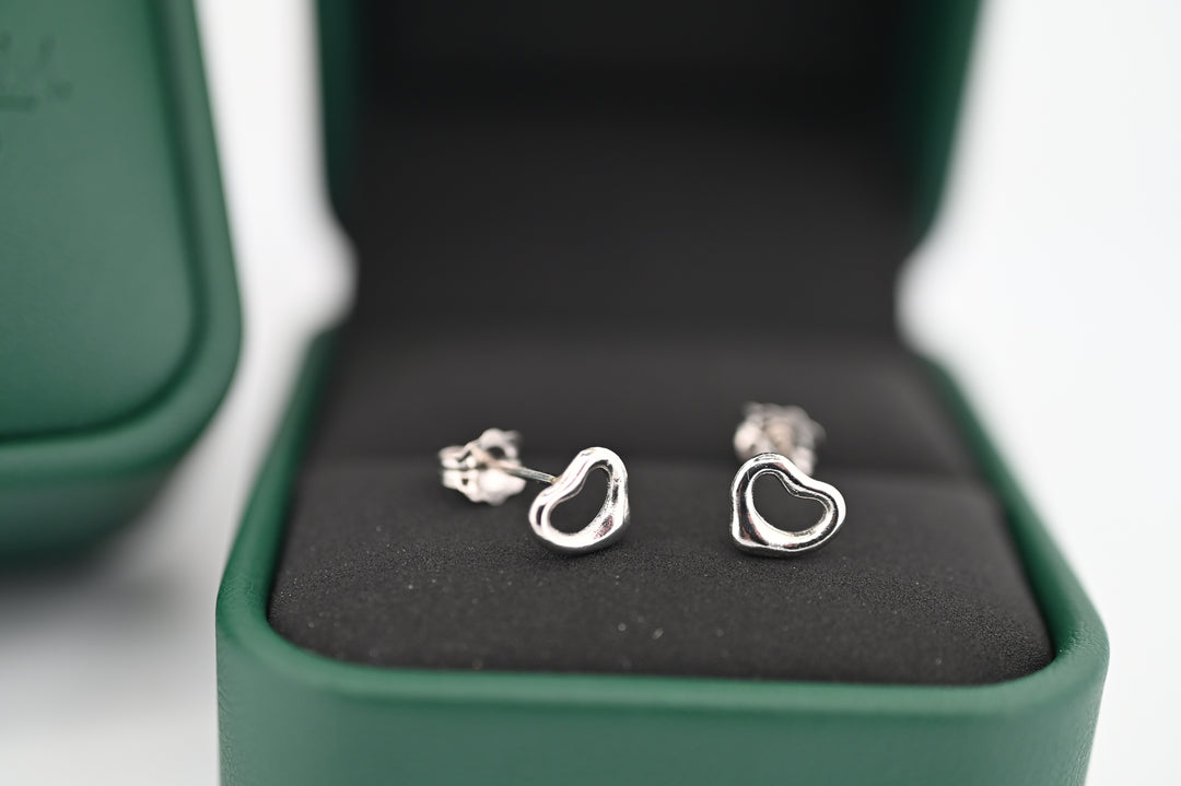 Platinum heart-shaped earrings in elegant gift box, perfect for ladies seeking timeless sophistication. Ideal luxury gift with lab-grown diamonds.