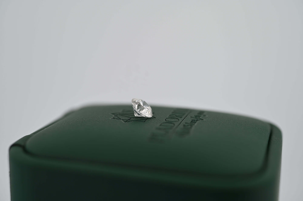 Lab-grown diamond on elegant display case, showcasing luxury and sustainability, perfect for premium gifts.
